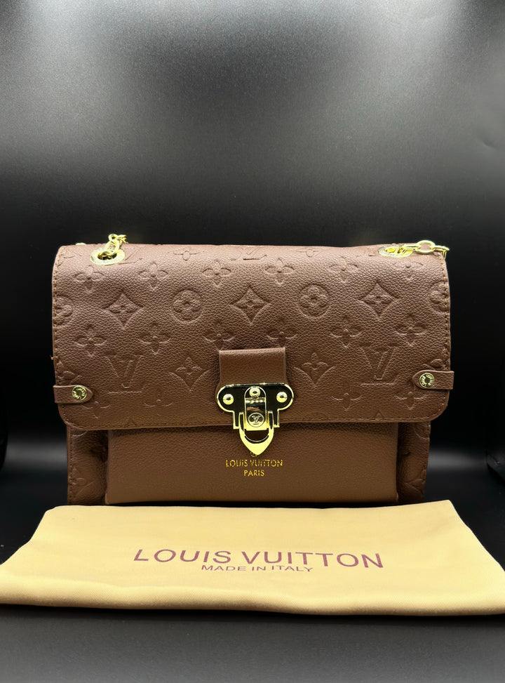 Authentic LV Vavin Chain Bag featuring Iconic Front Flap and Gold Clasp