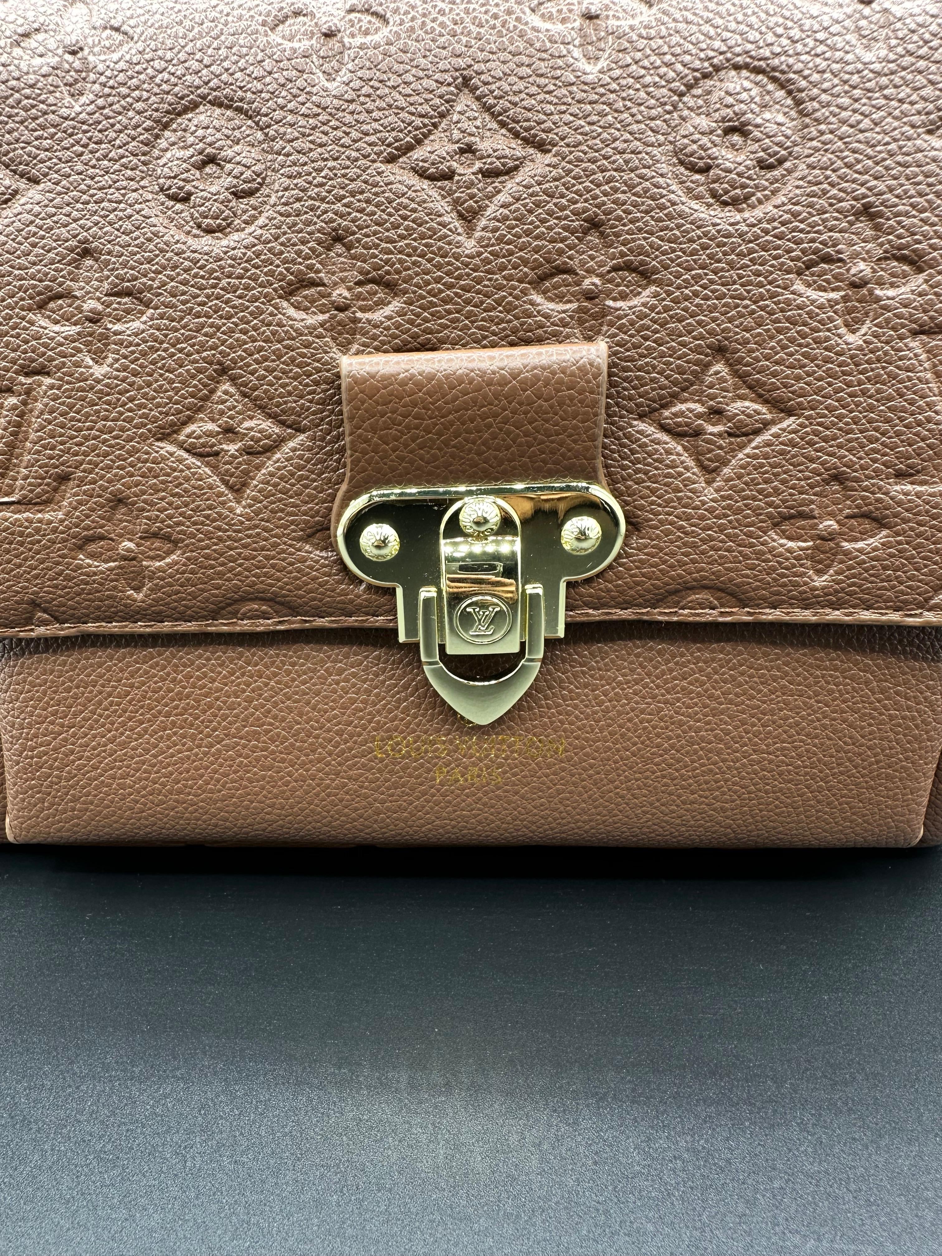 authentic lv vavin chain bag featuring iconic front flap and gold clasp authentic lv vavin chain bag featuring iconic front flap and gold clasp