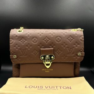 authentic lv vavin chain bag featuring iconic front flap and gold clasp