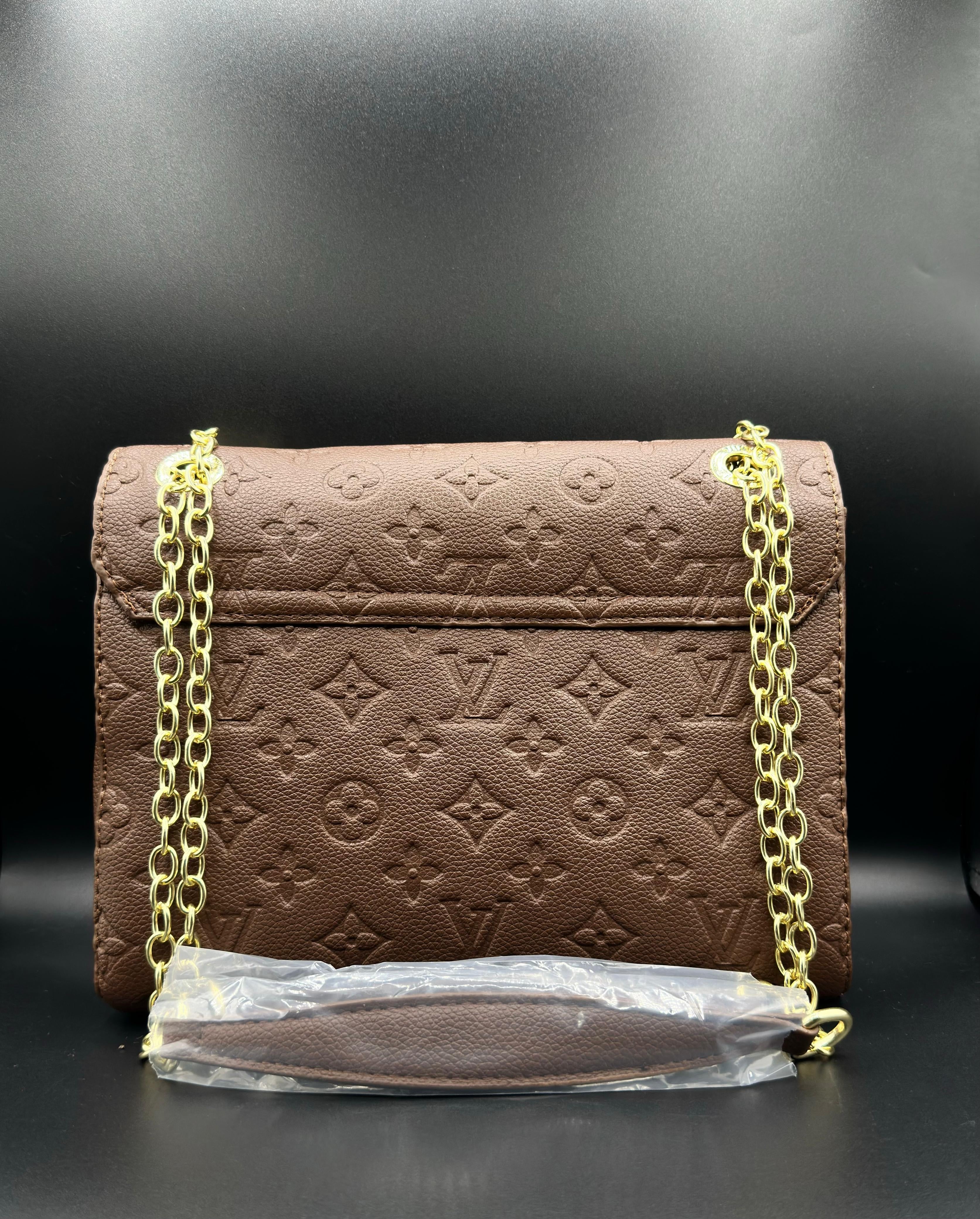authentic lv vavin chain bag featuring iconic front flap and gold clasp authentic lv vavin chain bag featuring iconic front flap and gold clasp